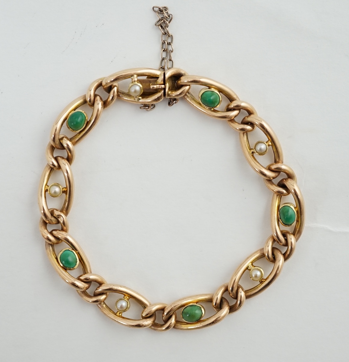 An early 20th century 15ct gold, turquoise and seed pearl set bracelet